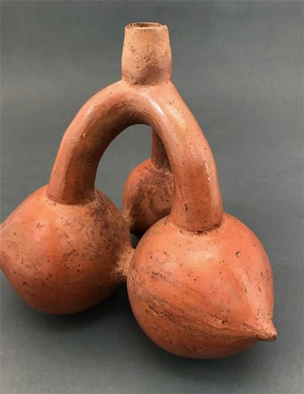 Antient bottle of Incas made in shape of the Canistel