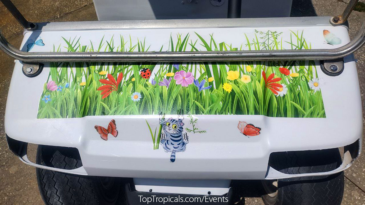 Golf cart with cats and flowers