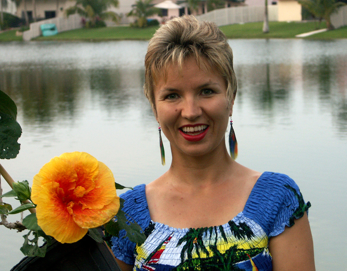 Tatiana Anderson, co-founder of Top Tropicals, with tropical flowers